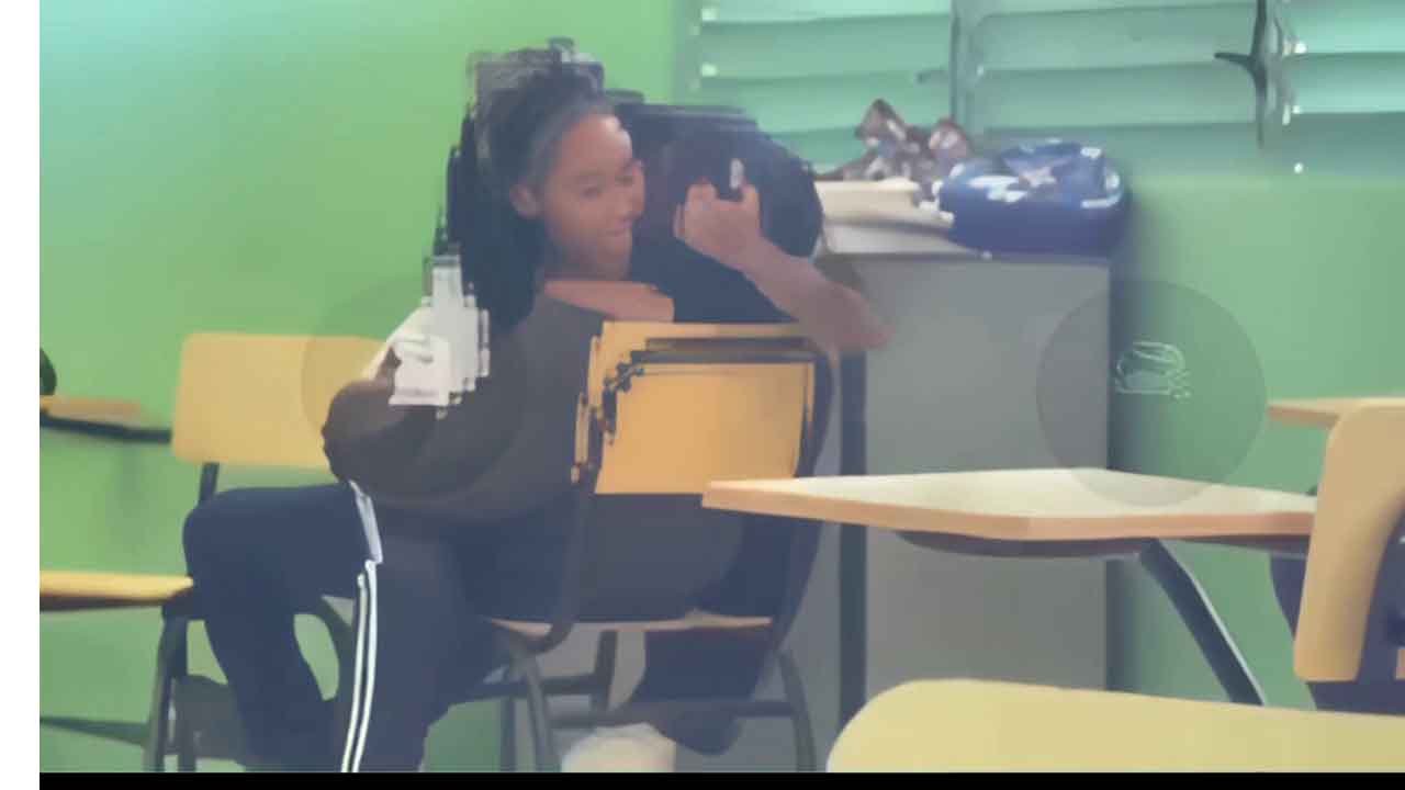 Black teen riding her friend in the classroom PORN AMATEUR